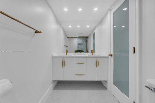 1201 S Ocean Dr Unit 507S, Hollywood, FL 33019 - bathroom with double vanity, recessed lighting, finished concrete flooring, and a shower