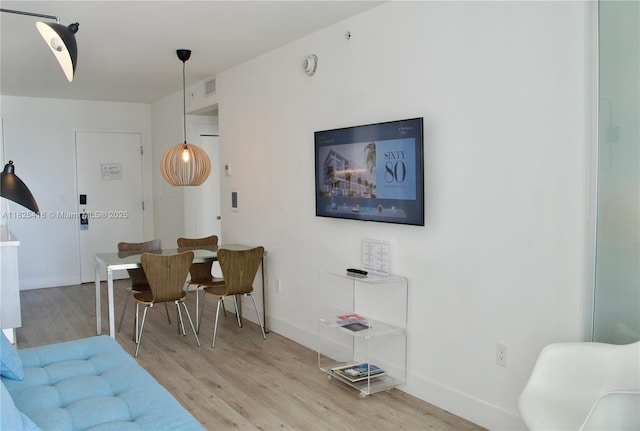 6080 Collins Ave Unit 506, Miami Beach, FL 33140 - living area featuring wood finished floors and baseboards