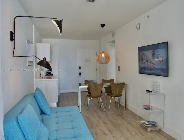 6080 Collins Ave Unit 506, Miami Beach, FL 33140 - living area with light wood-style floors and baseboards