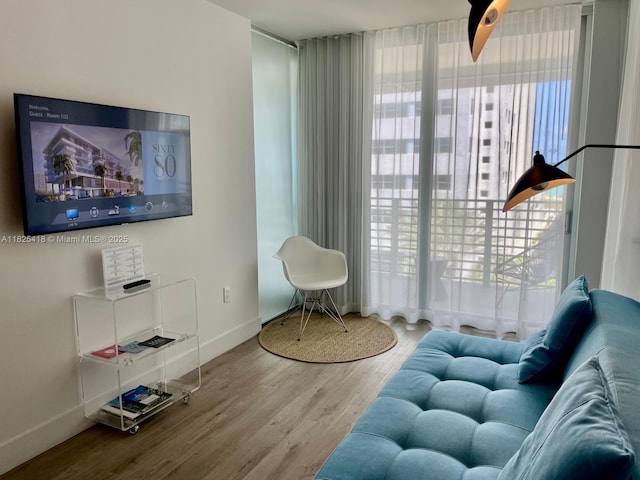 6080 Collins Ave Unit 506, Miami Beach, FL 33140 - living room featuring healthy amount of natural light and wood finished floors