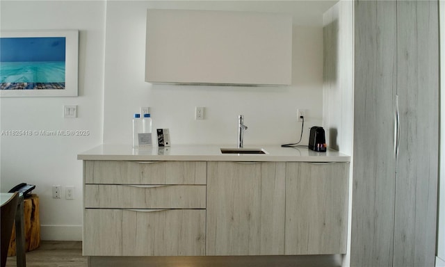 6080 Collins Ave Unit 506, Miami Beach, FL 33140 - bar featuring a sink and wood finished floors