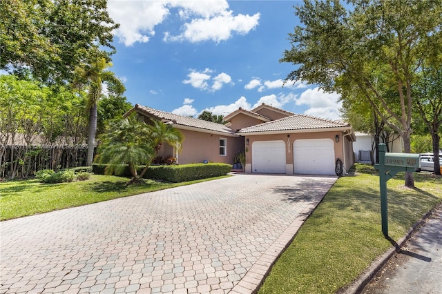 10989 NW 73rd Ter, Doral, FL 33178 - view of front of property featuring stucco siding, an attached garage, decorative driveway, and a tiled roof