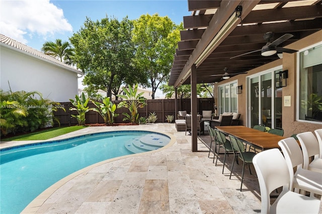 10989 NW 73rd Ter, Doral, FL 33178 - view of swimming pool featuring a fenced backyard, a patio area, a ceiling fan, an outdoor living space, and outdoor dining space