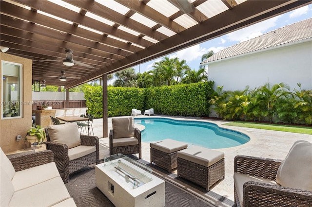 10989 NW 73rd Ter, Doral, FL 33178 - view of swimming pool featuring an outdoor living space with a fire pit, a patio area, a pergola, and a fenced backyard