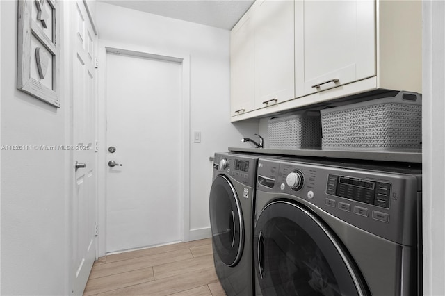 10989 NW 73rd Ter, Doral, FL 33178 - laundry room with cabinet space, washer and dryer, and wood tiled floors