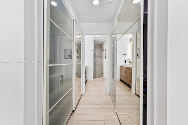 10989 NW 73rd Ter, Doral, FL 33178 - bathroom featuring vanity, wood finished floors, and recessed lighting
