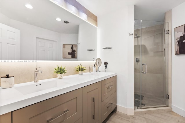 10989 NW 73rd Ter, Doral, FL 33178 - bathroom featuring double vanity, a shower stall, and recessed lighting
