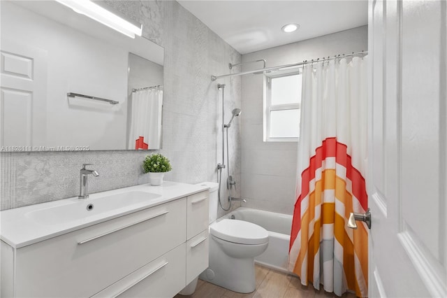 10989 NW 73rd Ter, Doral, FL 33178 - full bathroom featuring vanity, shower / bath combination with curtain, wood finished floors, and tile walls