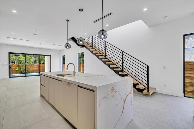 23 SE 12th Ave Unit A, Fort Lauderdale, FL 33301 - kitchen with modern cabinets, a center island with sink, recessed lighting, hanging light fixtures, and open floor plan