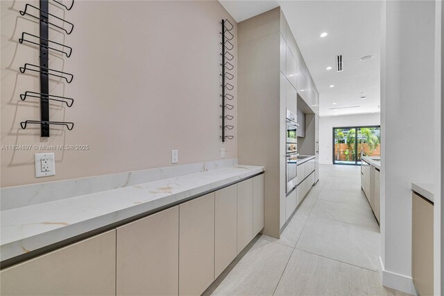 23 SE 12th Ave Unit A, Fort Lauderdale, FL 33301 - bar area featuring recessed lighting and light tile patterned flooring