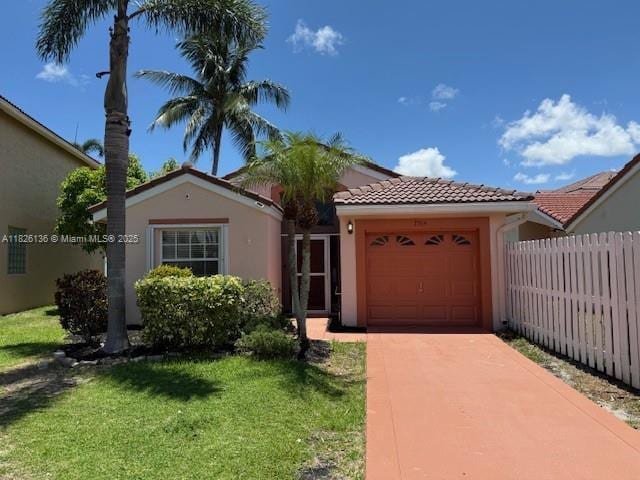 7964 La Rose Ct, Lake Worth, FL 33467 - view of front of home featuring a garage, a tiled roof, stucco siding, and driveway
