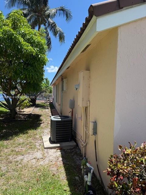 7964 La Rose Ct, Lake Worth, FL 33467 - view of home's exterior featuring stucco siding and a tile roof