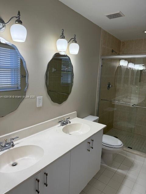 7964 La Rose Ct, Lake Worth, FL 33467 - full bath with double vanity, a stall shower, and tile patterned flooring