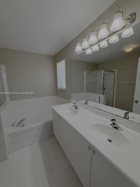 4390 NW 41st Pl, Coconut Creek, FL 33073 - bathroom with a bath, tile patterned floors, a shower stall, and double vanity