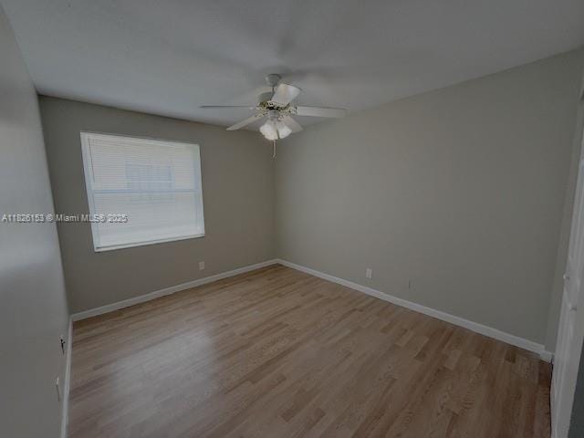 4390 NW 41st Pl, Coconut Creek, FL 33073 - empty room featuring a ceiling fan and wood finished floors