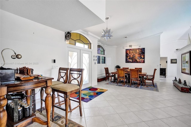 3820 SW 106th Ter, Davie, FL 33328 - dining space with ornamental molding, french doors, light tile patterned flooring, and high vaulted ceiling
