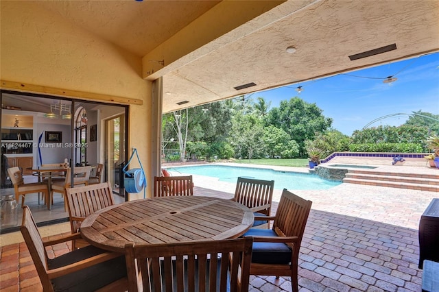 3820 SW 106th Ter, Davie, FL 33328 - view of patio / terrace with outdoor dining area and a pool with connected hot tub