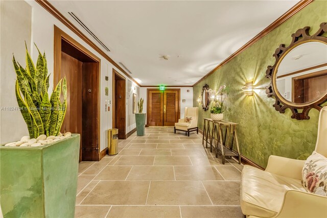 2951 S Bayshore Dr Unit 717, Miami, FL 33133 - lobby featuring ornamental molding and wallpapered walls