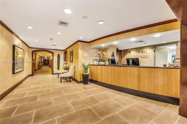 2951 S Bayshore Dr Unit 717, Miami, FL 33133 - reception area featuring ornamental molding, arched walkways, and recessed lighting