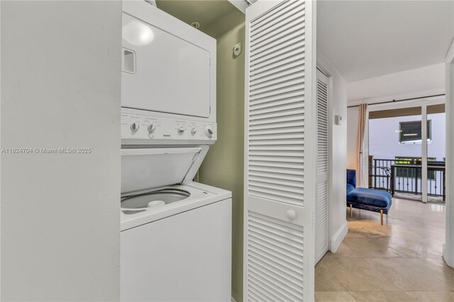 2951 S Bayshore Dr Unit 717, Miami, FL 33133 - laundry area featuring stacked washer and clothes dryer
