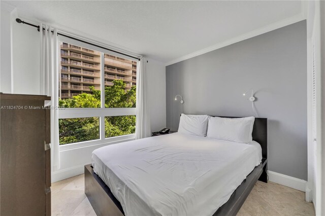 2951 S Bayshore Dr Unit 717, Miami, FL 33133 - bedroom with crown molding and baseboards