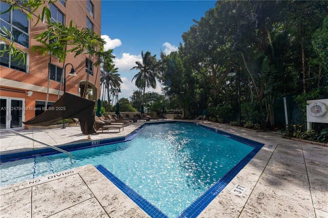 2951 S Bayshore Dr Unit 717, Miami, FL 33133 - community pool featuring a patio