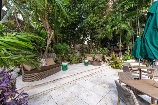 2951 S Bayshore Dr Unit 717, Miami, FL 33133 - view of patio with outdoor dining space