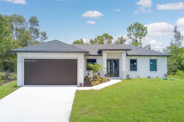 3216 40th St SW, Lehigh Acres, FL 33976 - prairie-style home featuring roof with shingles, an attached garage, concrete driveway, and a front yard