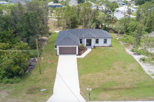 3216 40th St SW, Lehigh Acres, FL 33976 - view of front of house with a garage, concrete driveway, a front yard, a shingled roof, and stucco siding
