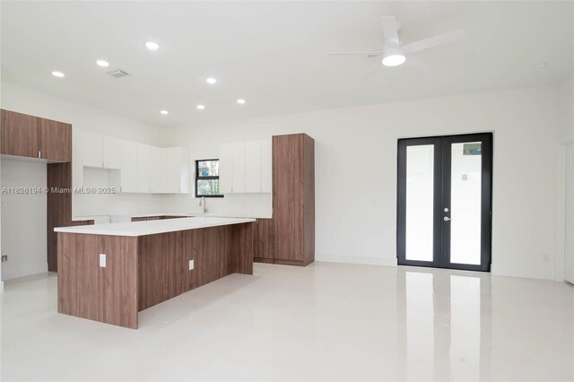 3216 40th St SW, Lehigh Acres, FL 33976 - kitchen with modern cabinets, white cabinetry, a kitchen island, and recessed lighting