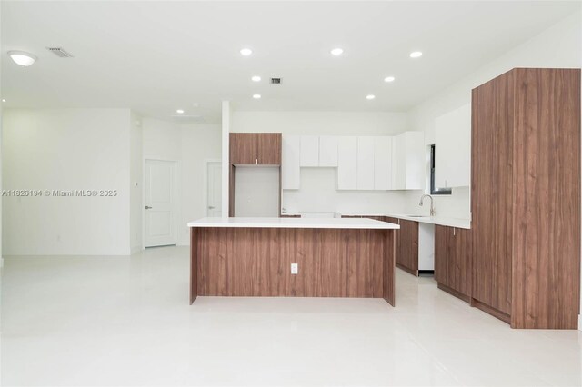 3216 40th St SW, Lehigh Acres, FL 33976 - kitchen featuring a center island, modern cabinets, white cabinetry, recessed lighting, and light countertops