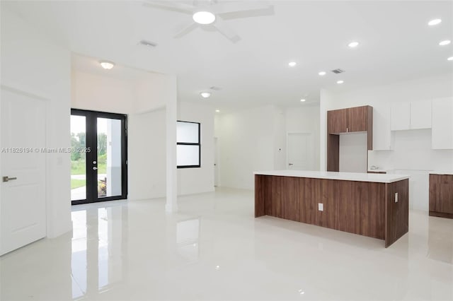 3216 40th St SW, Lehigh Acres, FL 33976 - kitchen with modern cabinets, white cabinets, ceiling fan, a center island, and recessed lighting