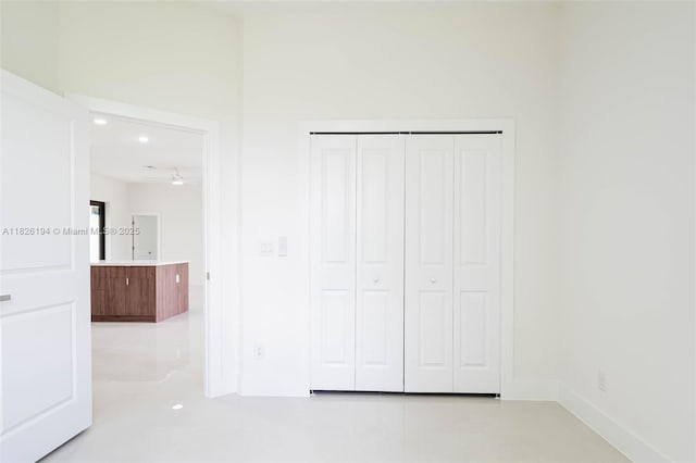 3216 40th St SW, Lehigh Acres, FL 33976 - unfurnished bedroom featuring baseboards and a closet