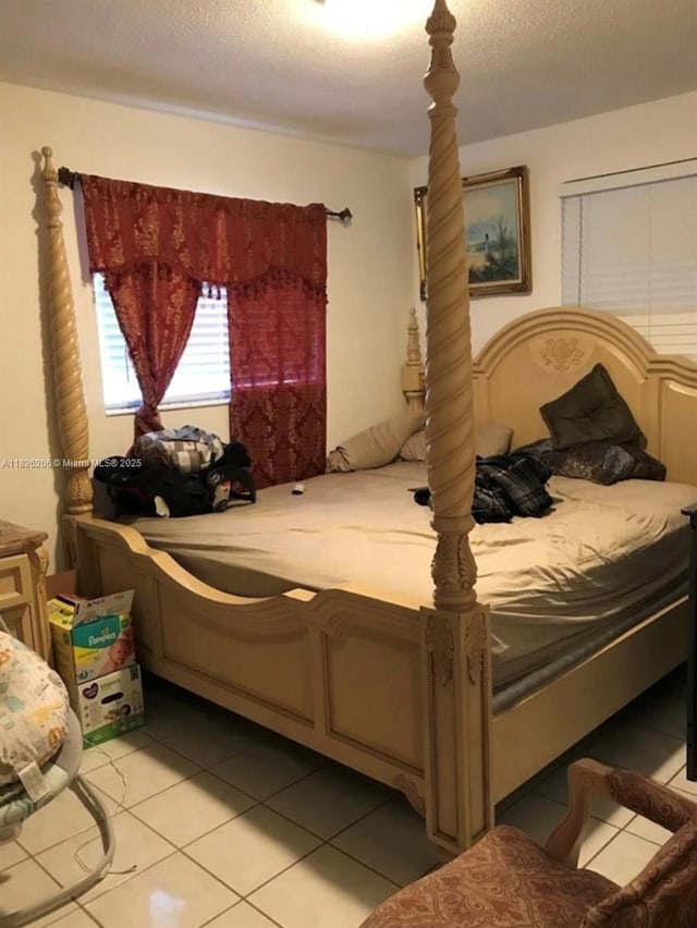7023 SW 19th St, North Lauderdale, FL 33068 - bedroom featuring light tile patterned flooring and a textured ceiling