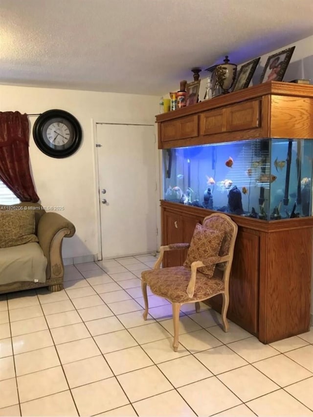 7023 SW 19th St, North Lauderdale, FL 33068 - living area featuring light tile patterned flooring and a textured ceiling