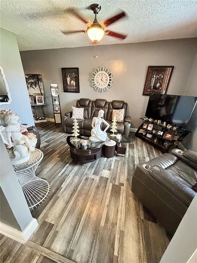 1041 NW 33rd Ave, Miami, FL 33125 - living area with wood finished floors, a ceiling fan, and a textured ceiling