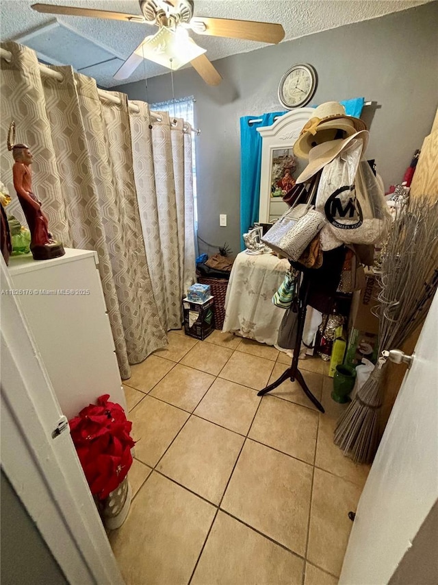 1041 NW 33rd Ave, Miami, FL 33125 - bathroom with tile patterned flooring, a ceiling fan, a textured ceiling, and curtained shower