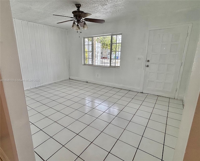 1041 NW 33rd Ave, Miami, FL 33125 - entryway featuring a ceiling fan, a textured ceiling, and light tile patterned flooring