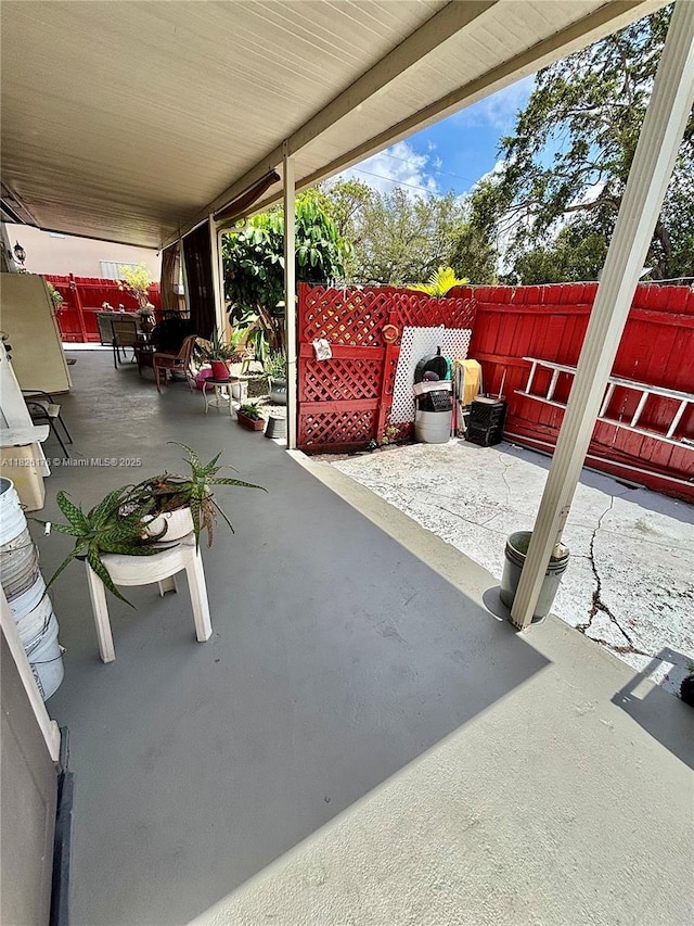 1041 NW 33rd Ave, Miami, FL 33125 - fenced backyard with a patio area