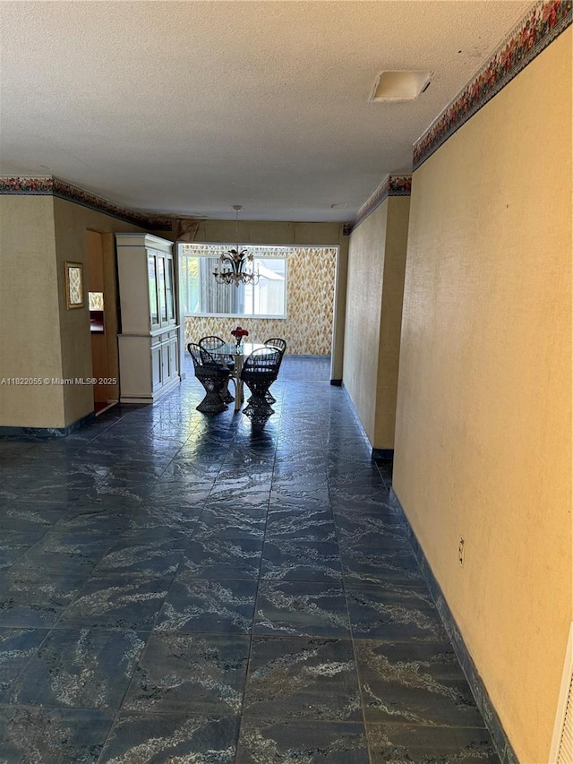 2247 NW 69th Ave, Sunrise, FL 33313 - hallway with a chandelier, a textured ceiling, and a textured wall