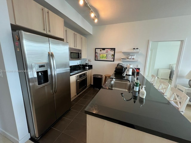 79 SW 12th St Unit 1603-S, Miami, FL 33130 - kitchen featuring appliances with stainless steel finishes, dark countertops, dark tile patterned flooring, and light brown cabinetry