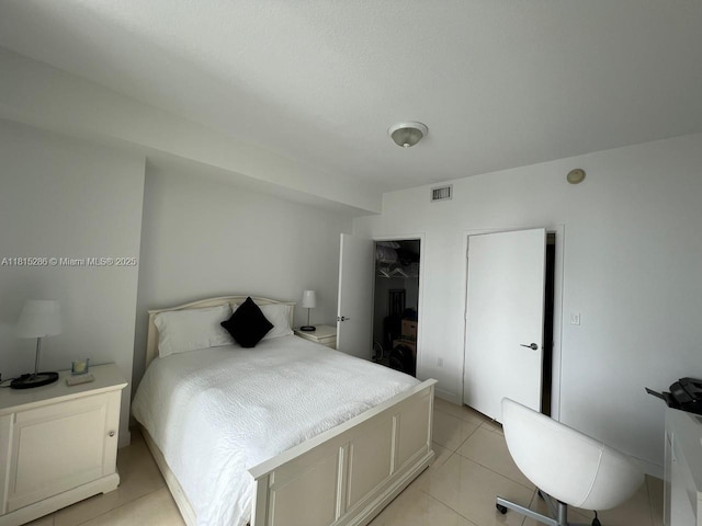 79 SW 12th St Unit 1603-S, Miami, FL 33130 - bedroom with light tile patterned floors, a closet, and a walk in closet