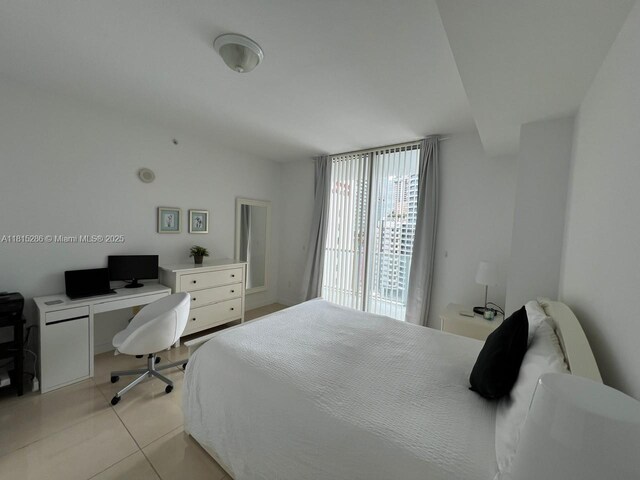 79 SW 12th St Unit 1603-S, Miami, FL 33130 - bedroom with light tile patterned flooring and an office area