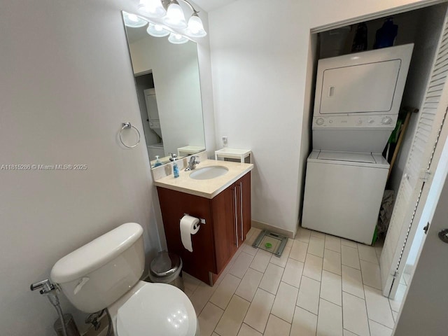 79 SW 12th St Unit 1603-S, Miami, FL 33130 - bathroom featuring stacked washer / drying machine, vanity, and tile patterned floors