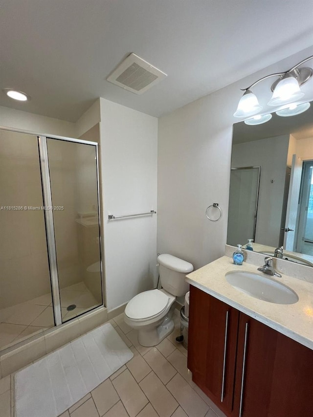 79 SW 12th St Unit 1603-S, Miami, FL 33130 - bathroom featuring vanity, a shower stall, and tile patterned floors
