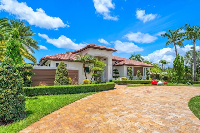 17490 SW 70th Pl, Southwest Ranches, FL 33331 - mediterranean / spanish house with a tile roof and stucco siding