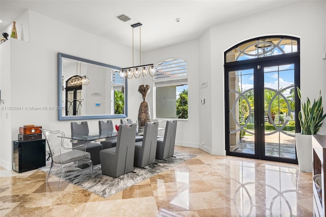 17490 SW 70th Pl, Southwest Ranches, FL 33331 - dining space with french doors and a chandelier