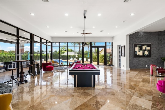 17490 SW 70th Pl, Southwest Ranches, FL 33331 - game room featuring french doors, healthy amount of natural light, recessed lighting, and light marble finish flooring