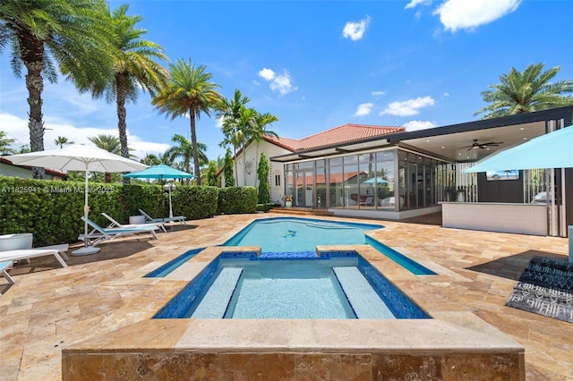 17490 SW 70th Pl, Southwest Ranches, FL 33331 - view of pool featuring a sunroom, a patio, a ceiling fan, and a pool with connected hot tub