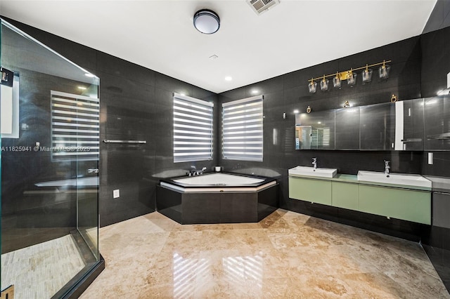 17490 SW 70th Pl, Southwest Ranches, FL 33331 - full bathroom with a garden tub, double vanity, a shower stall, and tile walls
